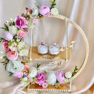 Engagement Ring Stand Decorated in shades of pink and white flowers
